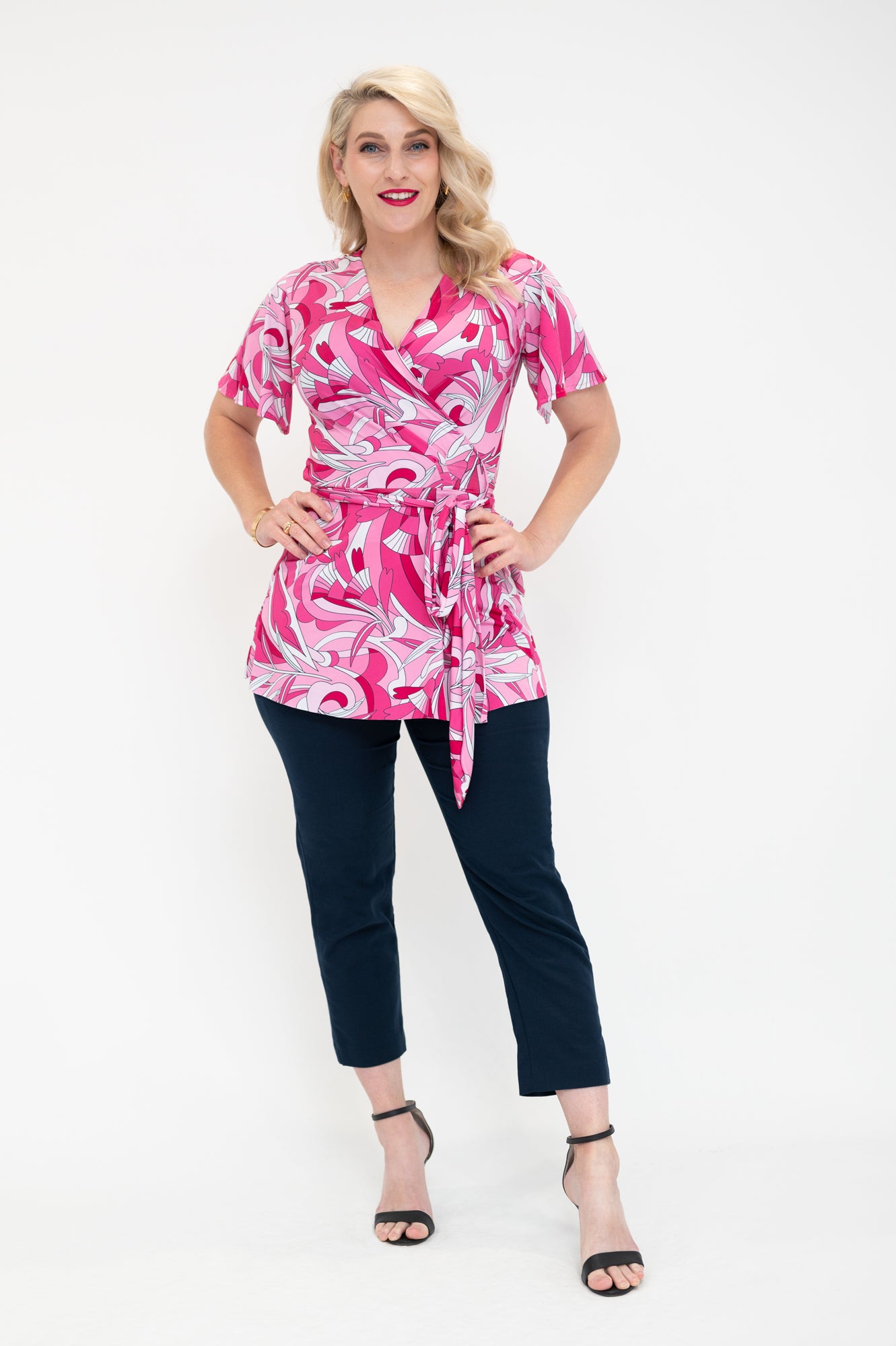 wrap top is pink retro print avaibale in plus size and  regular  sizes  with flutter sleeves 